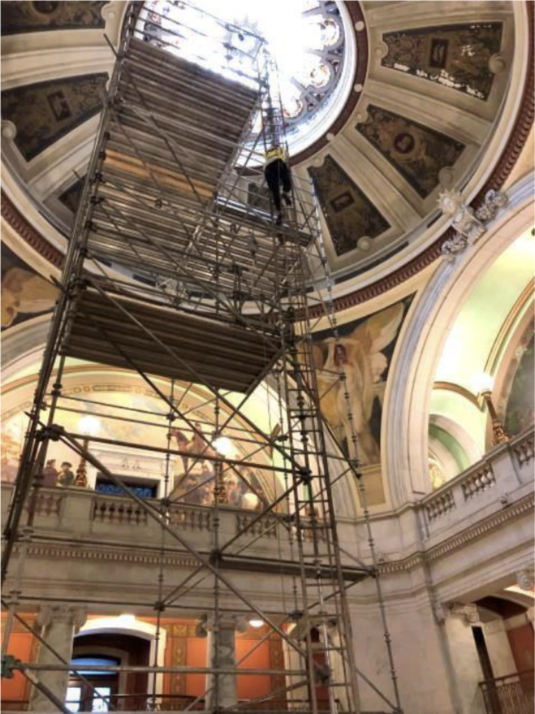 Initially, ceiling panels were accessed with a mobile scaffold tower (photo by EverGreene, June 2020)