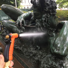 The Great God Pan, Rinsing the statue during cleaning